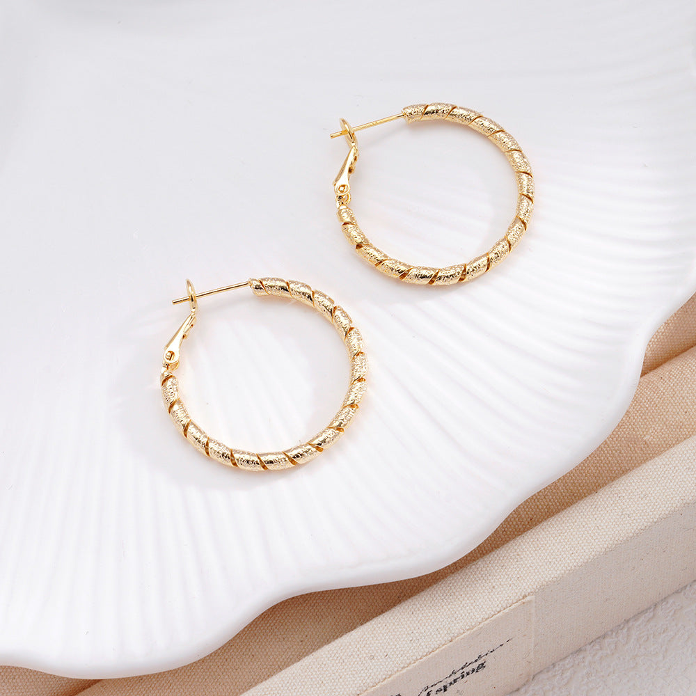 New Commuter-friendly Gold Twisted Hoop Earrings That Go With Everything
